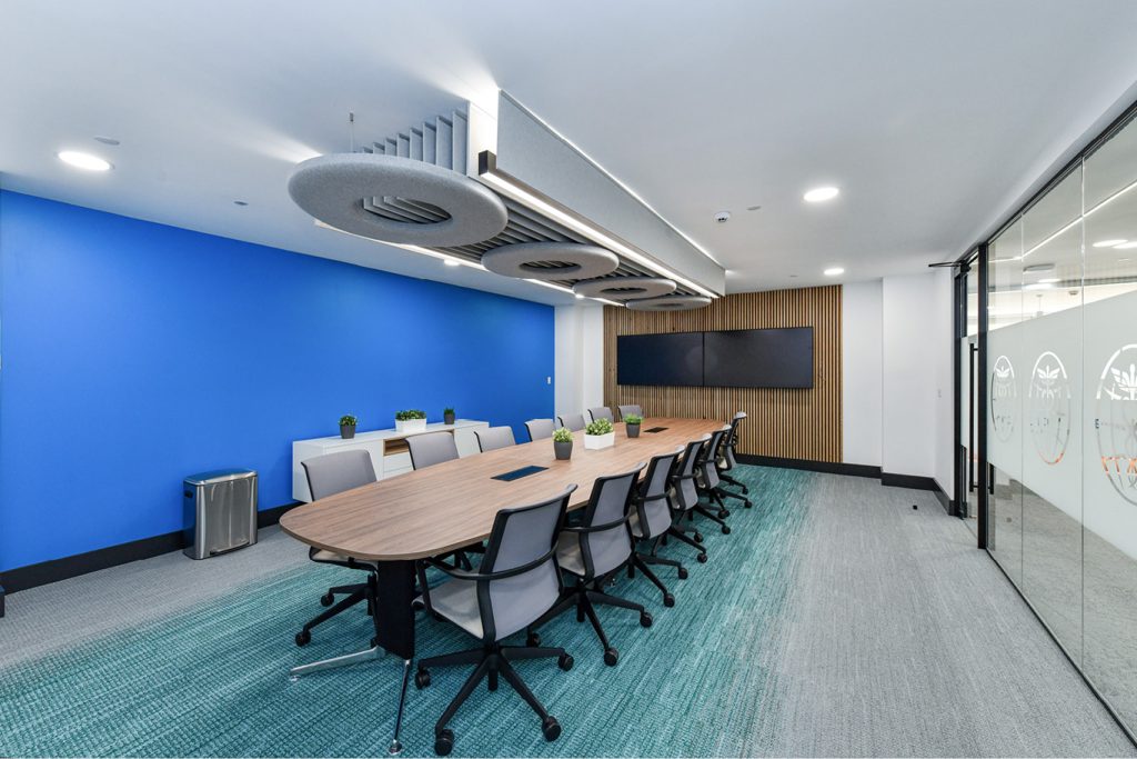 Office conference room with table and chairs on Interface carpet tile