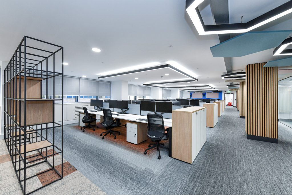 Office desks in open plan room on Interface carpet tile